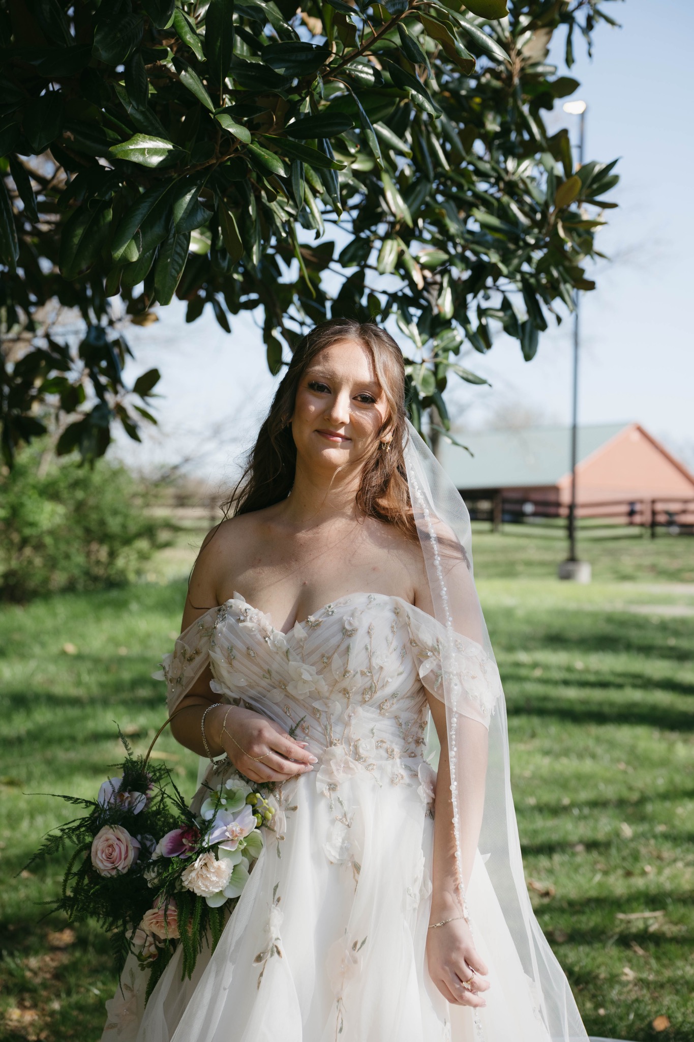 Bride outdoors with romantic soft glam makeup and hair