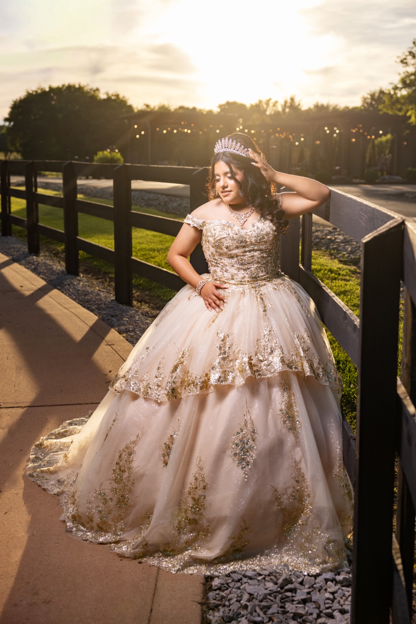 Quinceañera wearing her crown at golden hour